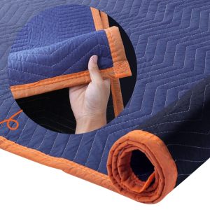 Close-up texture of quilted furniture removalist blankets, providing durable protection for moving items